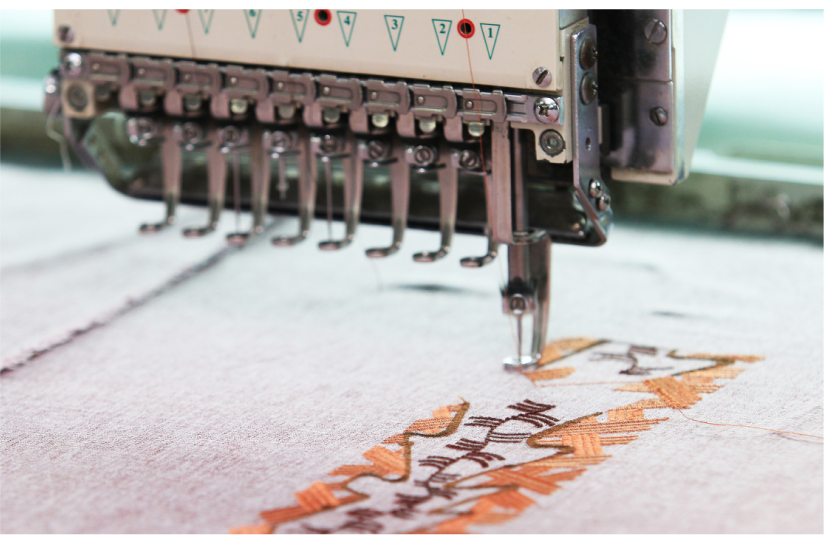 Close-up embroidery stitching: Detailed view of intricate embroidery stitches on fabric, showcasing the artistry and precision of embroidery work for custom designs.