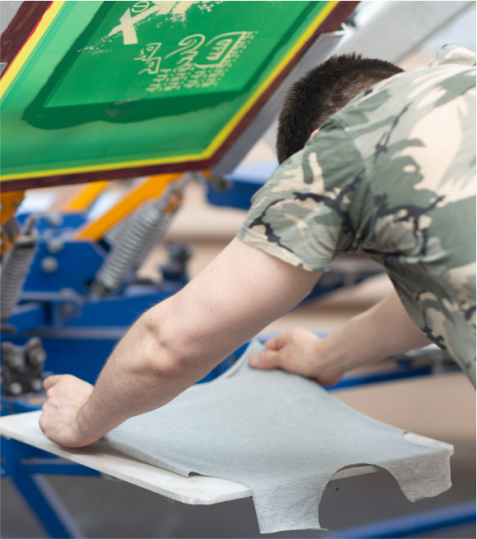 Screen printing shirt placement: placing shirt garment to screen printing machine for custom apparel.